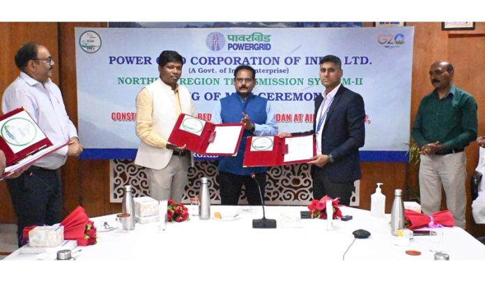Senior officers from Powergrid & AIIMS Bilaspur exchanging MoU documents on Thursday.