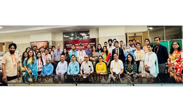 Delegates from India and abroad posing together during a surgical training workshop at AIIMS Jammu.