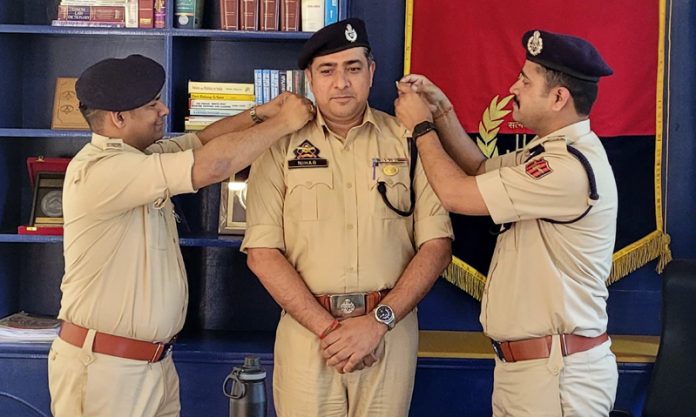DIG Shridhar Patil decorating DySP with SP rank on Tuesday.
