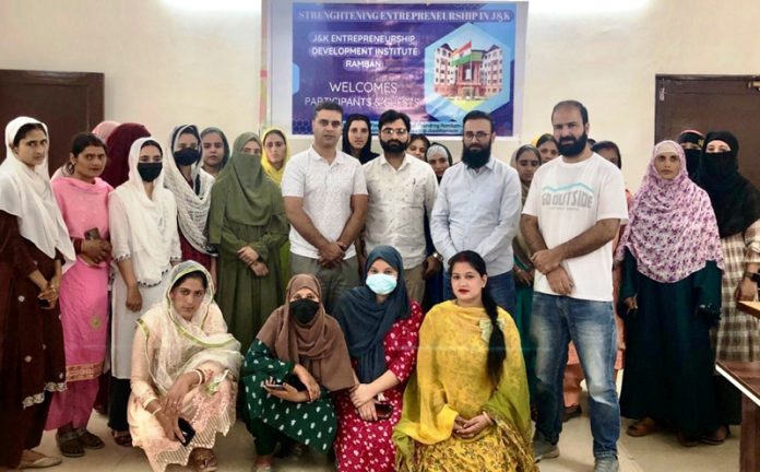 The candidates who completed their training under Tejaswini scheme posing with officers of JKEDI at Ramban during valedictory function on Saturday.