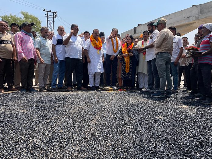 Senior BJP leader and former Minister, Chander Parkash Ganga and Chairman DDC, Samba, Keshaw Sharma kick starting blacktopping work of link road from Dhinsar to Bishnah on Saturday.