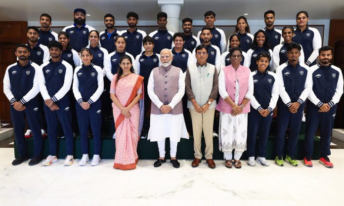 Prime Minister Narendra Modi in a group photograph with the Indian Contingent heading to Paris Olympic 2024, in New Delhi on Thursday.(UNI)