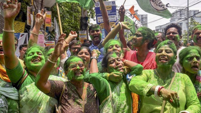 TMC supporters celebrate as party candidate Supti Pandey from Maniktala constituency leads during counting of votes for Assembly by-election, in Kolkata
