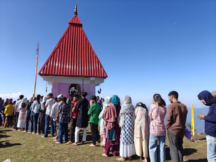 Devotees in queue at the shrine of Chamunda Mata shrine in Sarvadhar area of Ramban on Monday. -Excelsior/Shubam Anthal