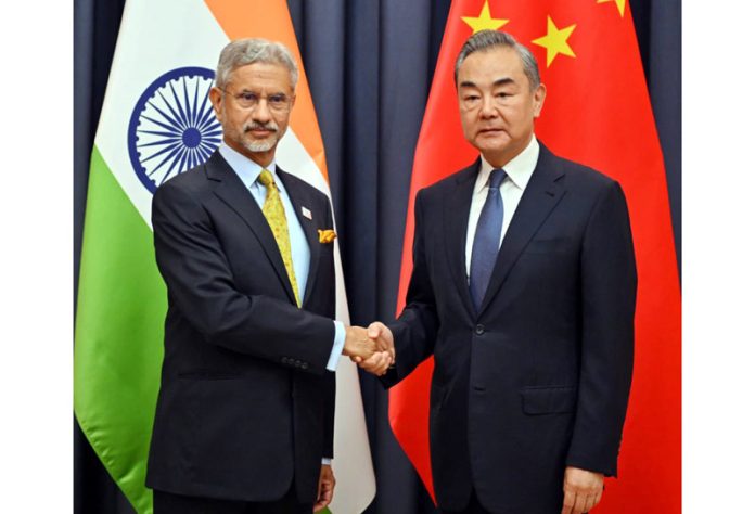 External Affairs Minister S Jaishankar meeting with Chinese Foreign Minister Wang Yi at Astana on Thursday. (UNI)
