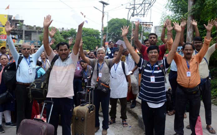 Amarnath bound yatris chanting ‘Bum Bum Bhole’ at Bhagwati Nagar Yatri Niwas on Thursday. -Excelsior/Rakesh