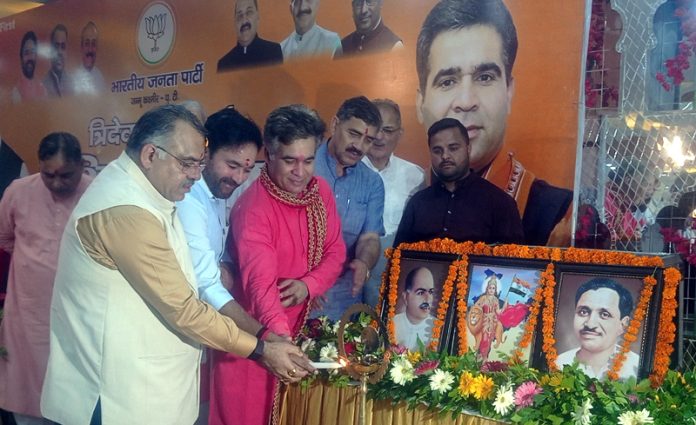 Union Minister G Kishan Reddy and other BJP leaders lighting the lamp at a party function at Jammu on Tuesday.