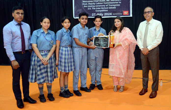 Students of KC Public School receiving certificate from chief guest.