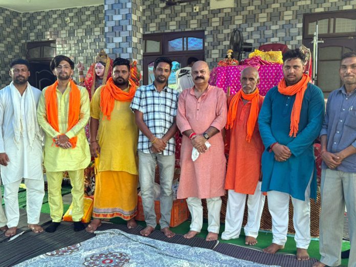 BJP leader, Yudhvir Sethi posing for a group photograph with others after meetings in Nagrota area on Saturday.