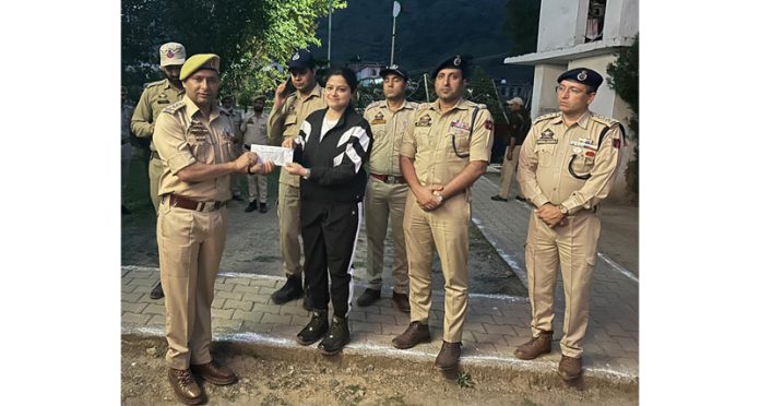 SSP Reasi Mohita Sharma rewarding cops for their bravery.