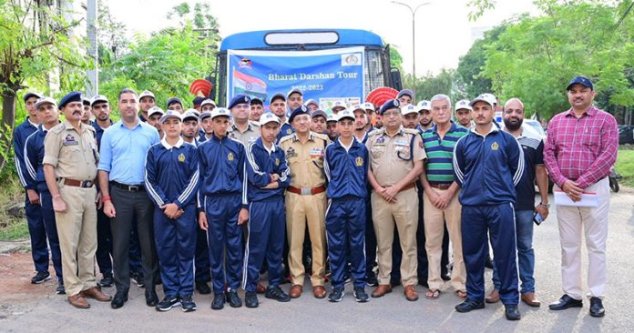 ADGP Jammu, flanked by other police officers, during the flagging off ceremony of Bharat Darshan tour from Gulshan Ground Jammu on Sunday.