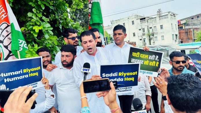 Youth Cong activists taking out protest march in Jammu. -Excelsior/Rakesh