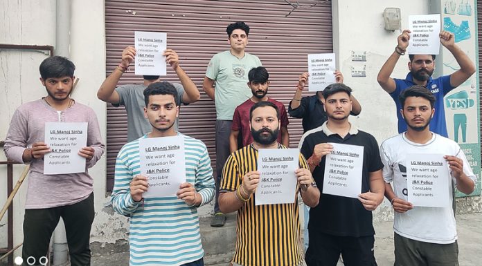 BJYM activists carrying placards in support of the demand for age relaxation in JKP Constable recruitment.
