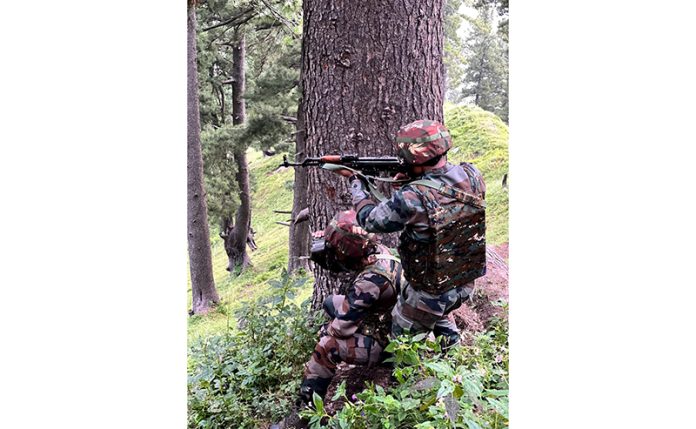 Troops take position in a forest area of Manjakote on Sunday. -Excelsior/Imran