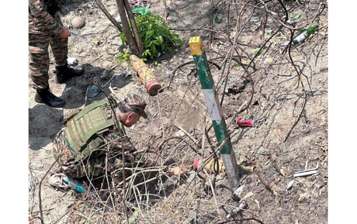 Army troops destroying rusted mortar shells near Nagrota in Jammu outskirts, on Tuesday. (UNI)