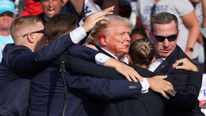 Video screenshot shows former US President Donald Trump being helped off the stage at a rally in Butler, Pennsylvania of the United States.