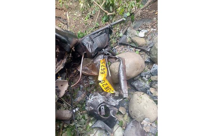 Remains of vehicle lying in gorge after accident near Jyotipuram in Reasi on Sunday. -Excelsior/Romesh Mengi