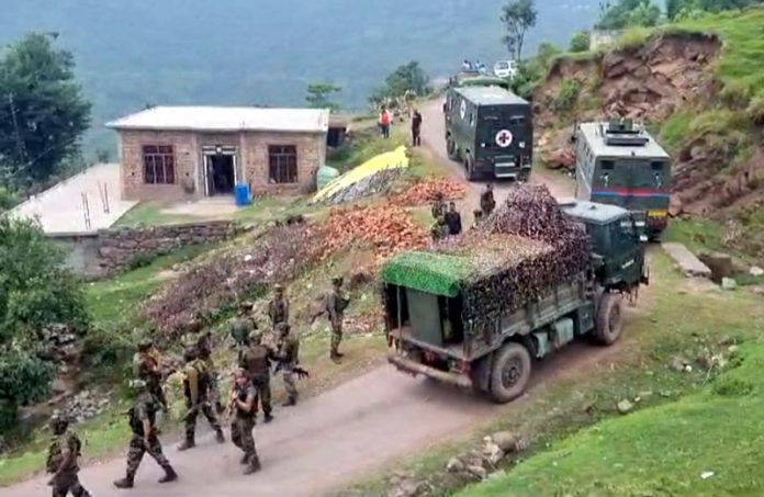 Troops rush to Gundha Khawas area of Budhal in Rajouri district on Monday. -Excelsior/Imran