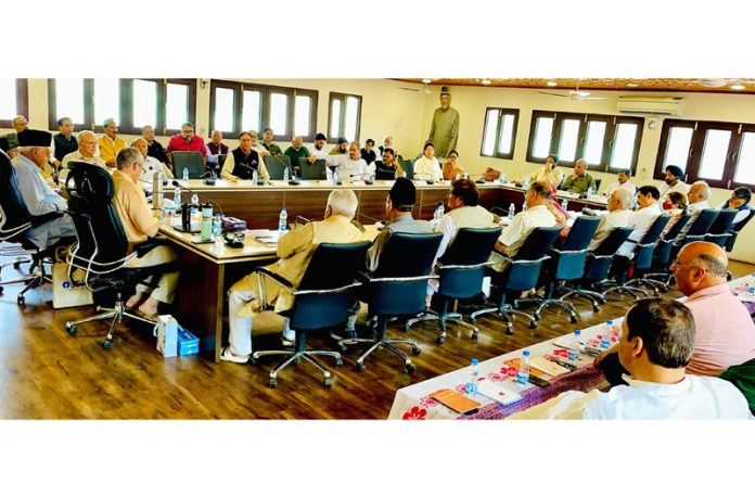 NC president Dr Farooq Abdullah chairing party Working Group meeting in Srinagar on Wednesday.