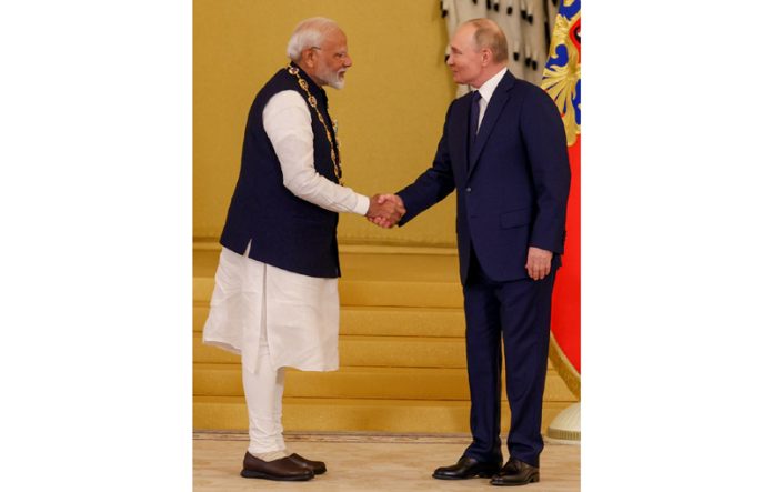 Prime Minister Narendra Modi being conferred with the ‘Order of Saint Andrew the Apostle’- Russia’s highest civilian award by President, Vladimir Putin in Moscow on Tuesday. (UNI)
