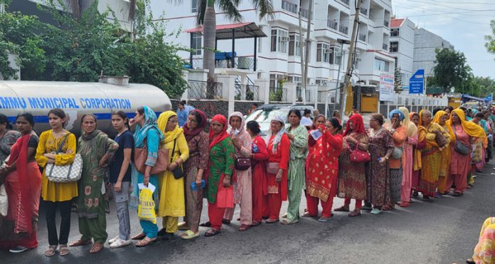 Yatris waiting in a long queue at Saraswati Dham near Railway Station Jammu for registration on Saturday. — Excelsior/Rakesh