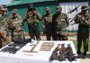 Security forces displaying arms and ammunition recovered from the militants at the two encounter sites in South Kashmir’s Kulgam district.