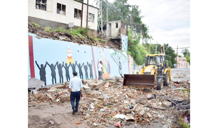 Outer wall of Civil Secretariat in Jammu partially collapsed due to heavy rain on Saturday. — Excelsior/Rakesh