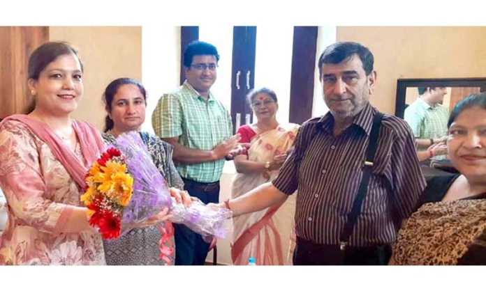 Dignitaries receiving flower bouquets from school management on Thursday.