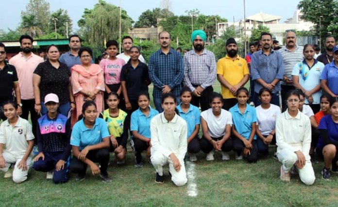 JKSC officers and other guests posing with winners of Tug of War event.