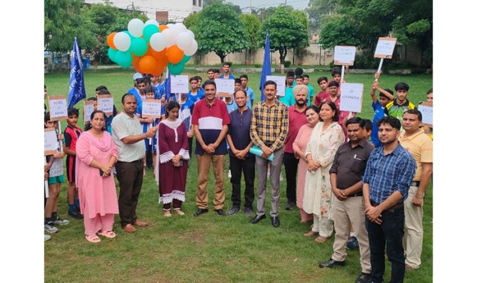 Teaching faculty and students posing during opening ceremony of Regional Sports Meet.