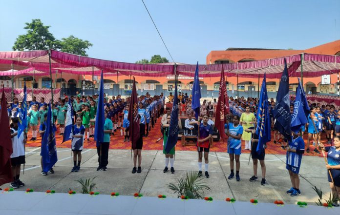 Students of different schools holding their flags during the opening ceremony of 53rd Regional Sports Meet at Nagrota.