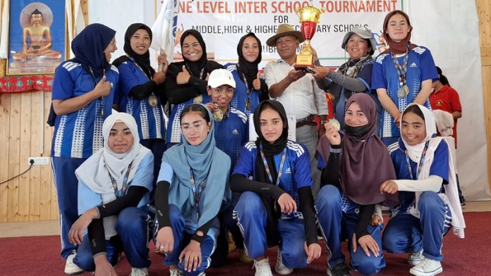 Winning team posing along with trophy during Inter School Zonal level tourney at Leh.