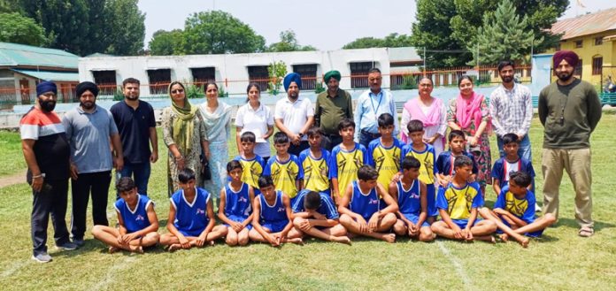 Budding players along with Zonal Physical Education officer DYSS Poonch posing for group photograph.
