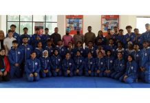 J&K Junior Wushu team posing with officials of JKSC and Association members.