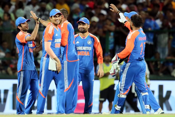 Team India celebrating after defeating Sri Lanka in Ist T20I match at Pallekele on Saturday.