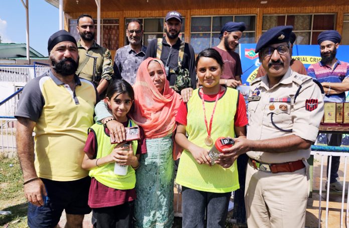 Participants of hockey summer camp posing with SP Firoz Yahya in Baramulla on Wednesday. —Excelsior/Aabid Nabi