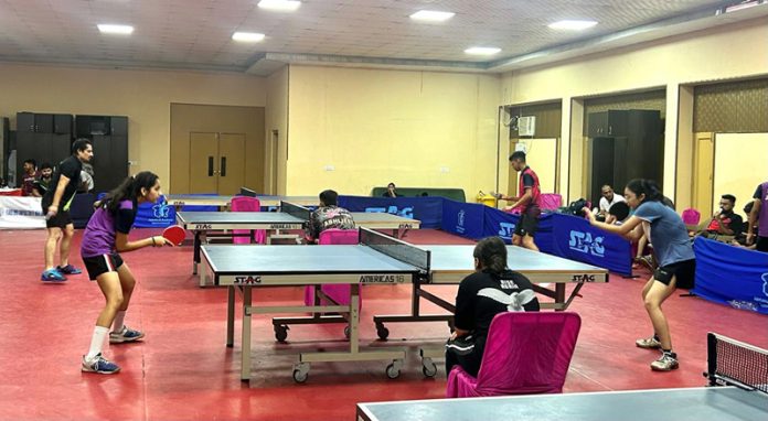 Girls in action in an ongoing 2nd J&K Table Tennis Ranking Championships 2024 at M.A Stadium on Sunday. -Excelsior/Rakesh