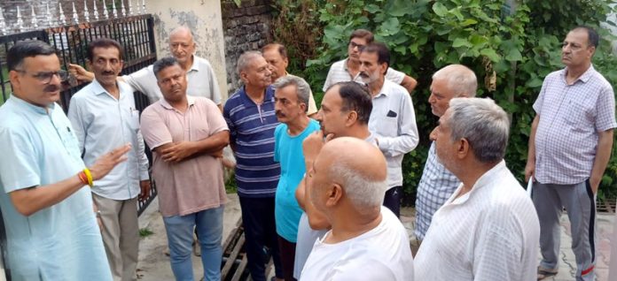 Former corporator and senior BJP leader, Sanjay Baru interacting with residents of Surya Vihar during his tour of area on Monday.