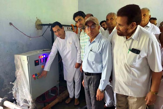 Senior BJP leader, Pandit Suresh Sharma inaugurating new motor pump in Chhamb Assembly Constituency on Tuesday.