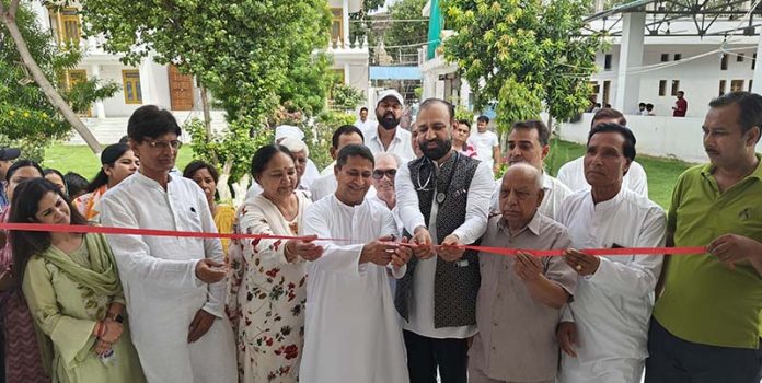 HoD Cardiology GMC & SSH Jammu Dr Sushil Sharma inaugurating free health camp at R S Pura on Sunday.