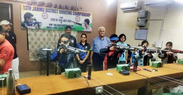 Shooters aiming at target on opening day of 13th Jammu District Shooting Championship at Jammu.