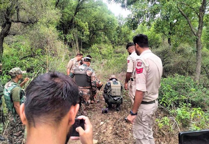 Police and Army team jointly destroying a mortar shell found in Khour area of Jammu on Thursday.