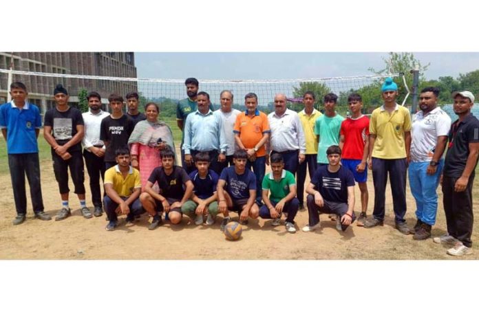 Aspiring players posing along with dignitaries during school games at Udhampur.