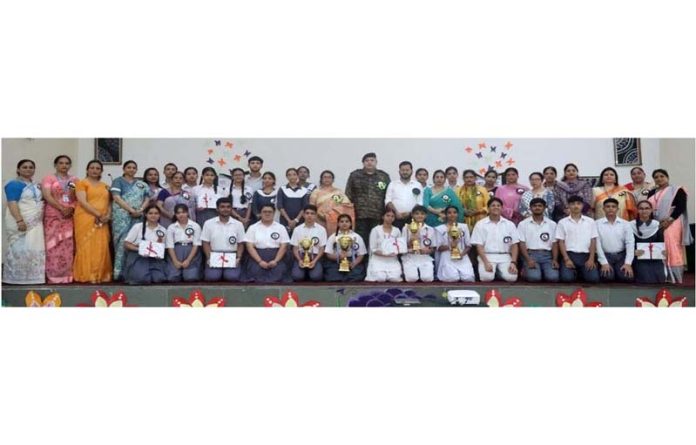 Students of different Army Public Schools posing with trophies during a debate competition on Wednesday.