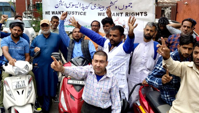 Members of J&K Handicapped Association during a protest in Srinagar on Monday. — Excelsior / Shakeel
