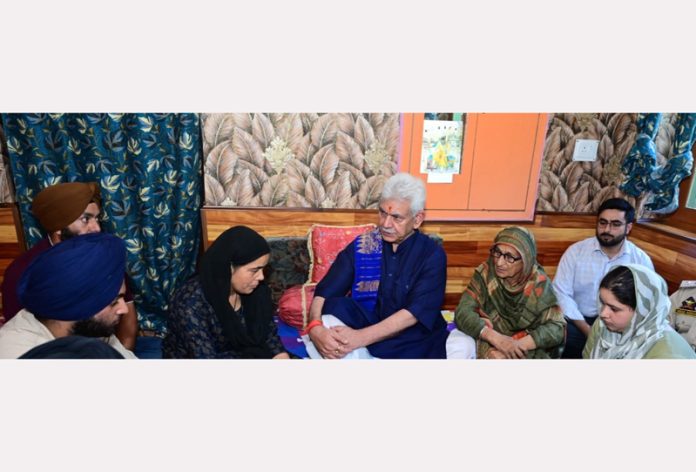 LG Manoj Sinha meeting with family members of deceased SSF personnel on Monday.