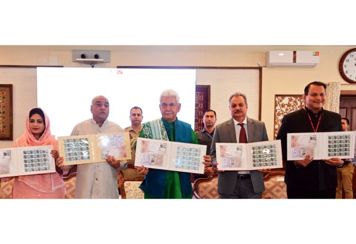 LG Manoj Sinha releasing commemorative postage stamp.