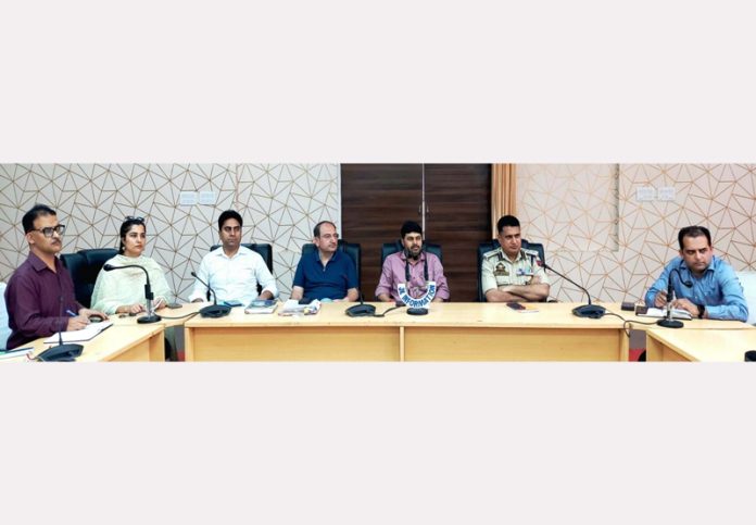 Deputy Commissioner Kishtwar Dr Devansh Yadav chairing a meeting on Monday.