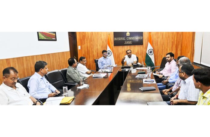 Div Com Jammu chairing a meeting.