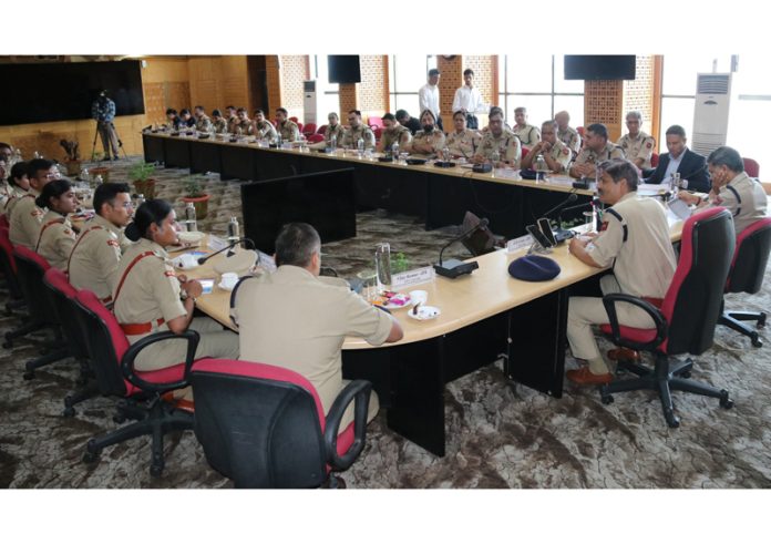 DGP J&K Police, RR Swain, interacting with probationary IPS officers at J&K Police Headquarters in Srinagar on Thursday.